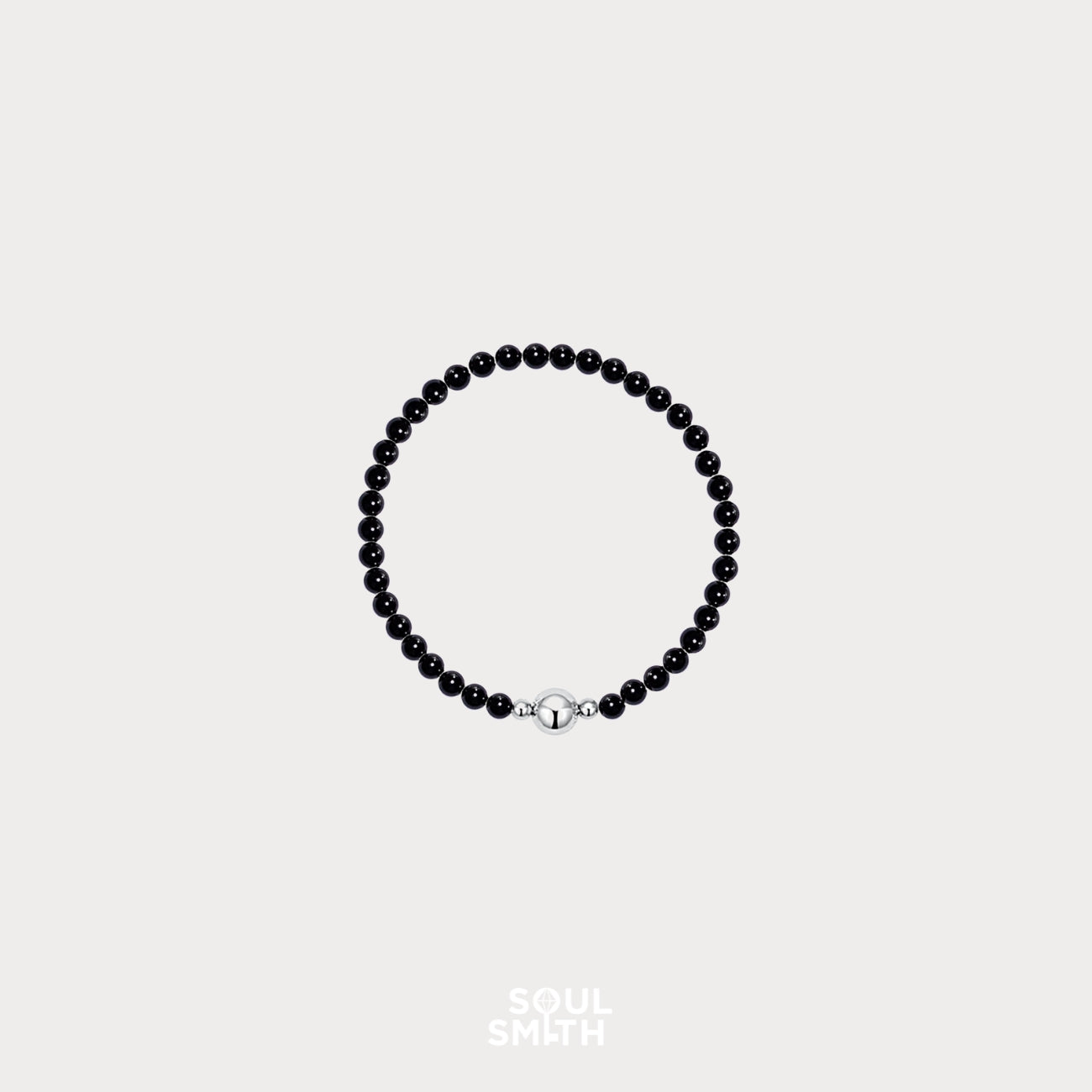 Soulsmith black onyx round bead bracelet with silver magnetic clasp, handcrafted for grounding energy, emotional strength, and root chakra balance.
