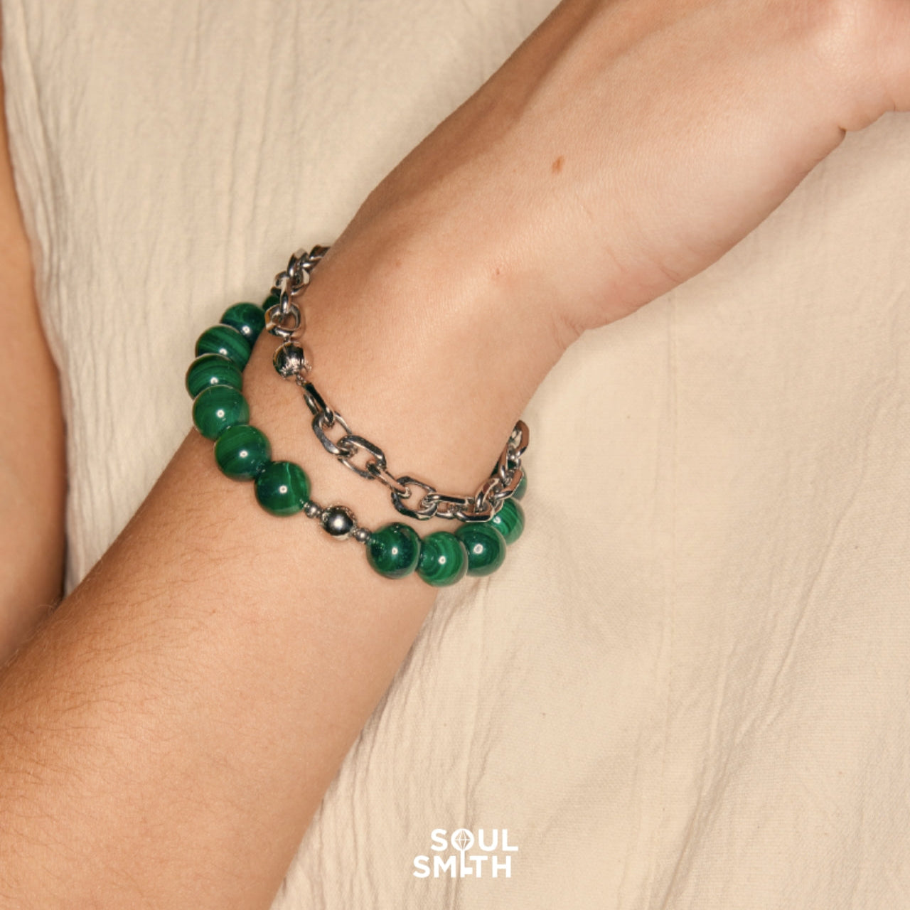 SOULSMTH Soullinks malachite bead bracelet stacked with chunky stainless steel chain, combining grounding energy and bold modern style