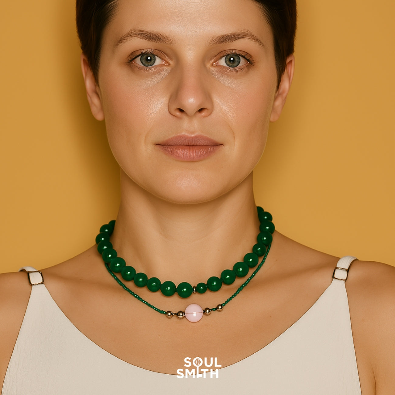 Woman wearing layered green malachite and rose quartz necklaces – handcrafted chakra jewelry by Soul Smith