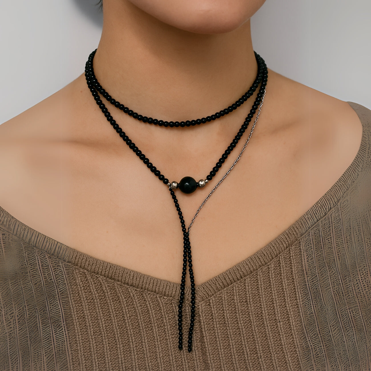 SOULSMTH Soullinks black obsidian Y-shaped layered necklace with silver accents, worn wrapped as a choker – protective crystal jewelry for grounding and strength