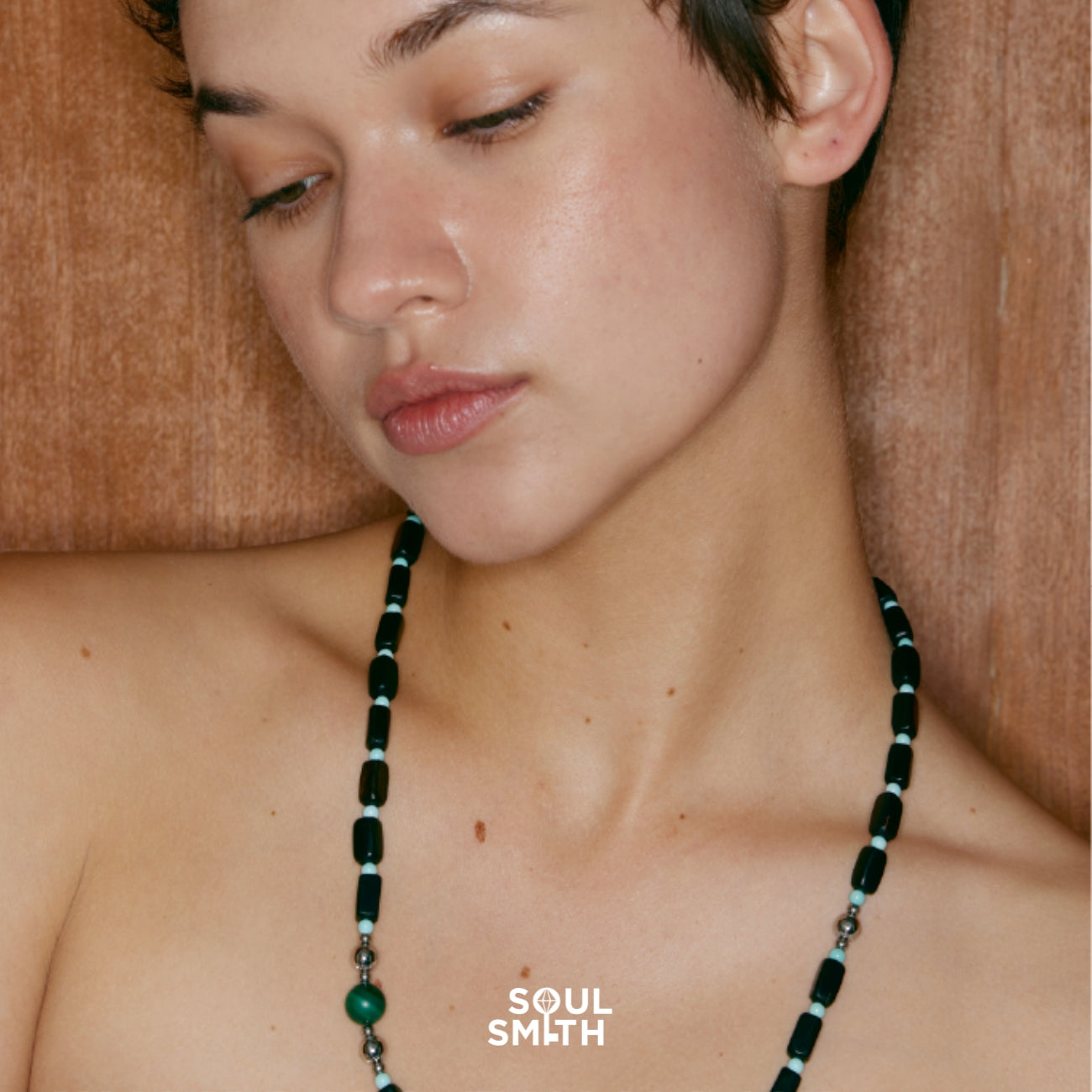 Model wearing long malachite and turquoise necklace aligned with heart chakra – SoulSmith