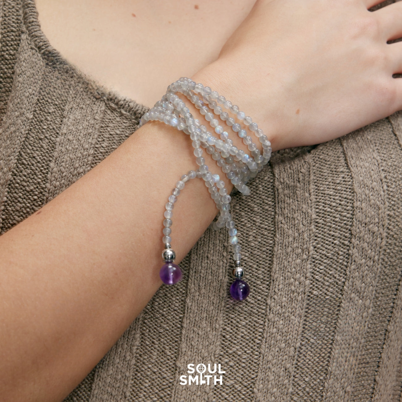 SoulSmith Soullinks moonstone rope necklace styled as a wrap bracelet with amethyst ends – versatile crystal jewelry for grounding and self-expression.