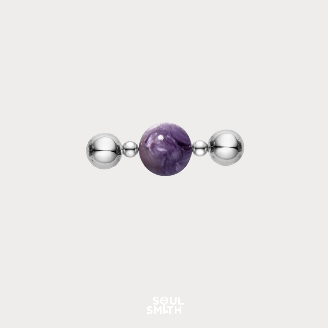 Charoite bead symbolizing crown chakra clarity with silver accents
