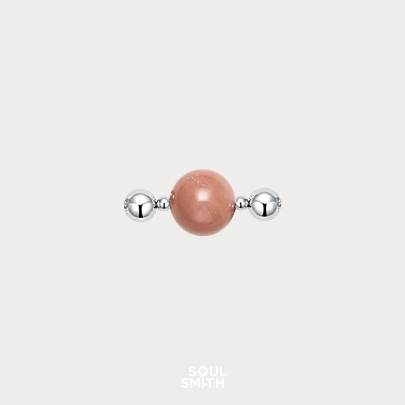 Orange moonstone charm for sacral chakra creativity and flow.

