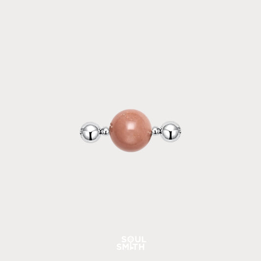 Orange moonstone charm for sacral chakra creativity and flow.
