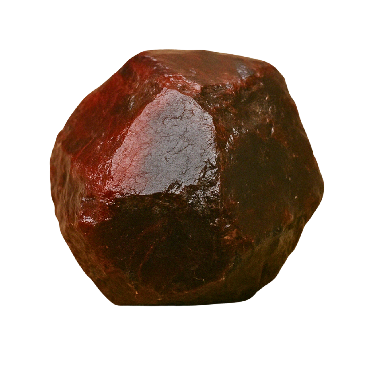Polished raw garnet crystal on transparent background